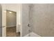 Well-lit bathroom featuring tiled shower, tub combo, and vanity at 11223 Spring Gate Trl, Bradenton, FL 34211