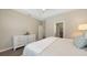 Comfortable bedroom featuring hardwood floors, a walk-in closet, and a ceiling fan at 11223 Spring Gate Trl, Bradenton, FL 34211