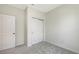 Neutrally decorated bedroom with a closet and plush carpeting at 11223 Spring Gate Trl, Bradenton, FL 34211