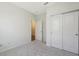 Light bedroom with a ceiling fan, closet, and neutral walls at 11223 Spring Gate Trl, Bradenton, FL 34211