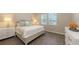 This primary bedroom features hardwood floors, natural light, and neutral colored walls at 11223 Spring Gate Trl, Bradenton, FL 34211