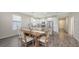 Dining room with an adjacent kitchen, island seating and stainless steel appliances at 11223 Spring Gate Trl, Bradenton, FL 34211