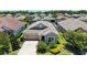 An aerial view of this single story home shows the landscaping and roof detail at 11223 Spring Gate Trl, Bradenton, FL 34211
