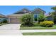 Charming single-story home features a manicured lawn and a welcoming two-car garage at 11223 Spring Gate Trl, Bradenton, FL 34211