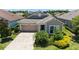 Charming single-story home features a manicured lawn and a welcoming two-car garage at 11223 Spring Gate Trl, Bradenton, FL 34211