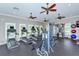 Gym featuring treadmills, weight machines, rubber floor and ceiling fans at 11223 Spring Gate Trl, Bradenton, FL 34211