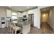 Spacious kitchen with white cabinets, granite countertops, stainless steel appliances, and breakfast bar at 11223 Spring Gate Trl, Bradenton, FL 34211