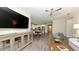 Spacious open-concept living room, dining, and kitchen area with modern furnishings and plenty of natural light at 11223 Spring Gate Trl, Bradenton, FL 34211