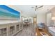 Open floorplan blending living and dining areas with a view into the kitchen and outdoor access at 11223 Spring Gate Trl, Bradenton, FL 34211