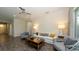 Bright living room featuring modern furnishings, wood-look floors, and a neutral color palette at 11223 Spring Gate Trl, Bradenton, FL 34211