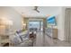 Open-concept living area with neutral paint, tile floors, and access to the outdoor space at 11223 Spring Gate Trl, Bradenton, FL 34211