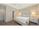 Neutral colored main bedroom featuring a ceiling fan, hardwood floors, and a walk-in closet at 11223 Spring Gate Trl, Bradenton, FL 34211