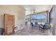 Covered patio with stylish furniture overlooking a private pool area and lush green lawn at 11223 Spring Gate Trl, Bradenton, FL 34211