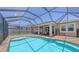 Inviting pool and patio area perfect for outdoor entertaining and relaxation in a private backyard at 11223 Spring Gate Trl, Bradenton, FL 34211