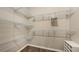 Spacious walk-in closet with hanging racks, shelves, and shoe storage at 11223 Spring Gate Trl, Bradenton, FL 34211