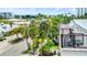 Charming neighborhood view from the rooftop, featuring lush greenery and colorful homes near the beach at 119 Avenida Messina, Sarasota, FL 34242