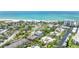 Aerial view of beach neighborhood, featuring the 3-story home with a rooftop deck at 119 Avenida Messina, Sarasota, FL 34242