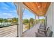 Spacious balcony with comfortable seating offers panoramic views of the neighborhood at 119 Avenida Messina, Sarasota, FL 34242