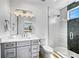 Beautiful bathroom featuring a glass-enclosed shower, modern vanity, and stylish lighting fixture at 119 Avenida Messina, Sarasota, FL 34242