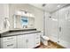 Modern bathroom with a sleek vanity, walk-in shower, and contemporary fixtures at 119 Avenida Messina, Sarasota, FL 34242