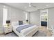 Bright bedroom featuring stylish decor, ensuite bathroom, and large window at 119 Avenida Messina, Sarasota, FL 34242
