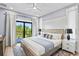 Inviting bedroom with private balcony access, stylish decor, and a serene ambiance at 119 Avenida Messina, Sarasota, FL 34242