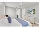 Bright bedroom with mounted TV, and modern decor at 119 Avenida Messina, Sarasota, FL 34242