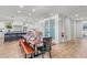 Spacious dining area open to the kitchen, features a wooden table, and modern décor at 119 Avenida Messina, Sarasota, FL 34242