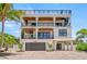 Stunning three-story beach house with a spiral staircase and multiple balconies at 119 Avenida Messina, Sarasota, FL 34242
