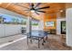 The outdoor game area includes a ping pong table, ceiling fan, grill and seating for relaxation at 119 Avenida Messina, Sarasota, FL 34242