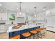 Modern kitchen featuring a large island with seating and high-end appliances at 119 Avenida Messina, Sarasota, FL 34242