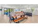 Open living space featuring a dining area, modern kitchen, and comfortable seating area at 119 Avenida Messina, Sarasota, FL 34242
