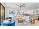 Comfortable living room with modern furniture, open to the kitchen and dining area at 119 Avenida Messina, Sarasota, FL 34242