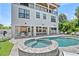 Beautiful backyard with a pool, spa, and outdoor entertaining area including a grill and ping pong table at 119 Avenida Messina, Sarasota, FL 34242