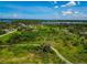 Beautiful aerial view of a lush community featuring a mix of green spaces and residential properties at 1230 Bayshore Dr, Terra Ceia, FL 34250