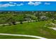 Expansive green landscape featuring scattered homes and winding roads, close to a calm, blue waterfront at 1230 Bayshore Dr, Terra Ceia, FL 34250