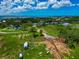 Aerial view of neighborhood featuring waterfront views and lush landscape at 1230 Bayshore Dr, Terra Ceia, FL 34250