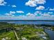 Expansive aerial view of waterfront community, showcasing natural beauty and serene coastal living at 1230 Bayshore Dr, Terra Ceia, FL 34250