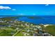 Picturesque aerial of waterfront properties, showcasing stunning views of the bay and charming coastal homes at 1230 Bayshore Dr, Terra Ceia, FL 34250