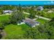 Charming single-story home surrounded by lush greenery, offering privacy and a peaceful setting at 1230 Bayshore Dr, Terra Ceia, FL 34250