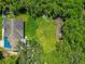 Aerial view showcasing lush green yard and surroundings, perfect for outdoor activities and relaxation at 1230 Bayshore Dr, Terra Ceia, FL 34250