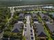 Aerial view of multiple modern apartment buildings with parking and trees at 13084 Tigers Eye Dr, Venice, FL 34292