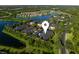Aerial view of the community, highlighting the prime location near the water, lush landscaping, and ample parking at 13084 Tigers Eye Dr, Venice, FL 34292