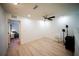 Bright bonus room boasts wood-look flooring, ceiling fan, and lots of natural light at 13084 Tigers Eye Dr, Venice, FL 34292