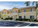 Eye-level exterior shot showcasing the facade with lush landscaping and parking at 13084 Tigers Eye Dr, Venice, FL 34292