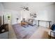 Cozy living room with tile flooring, contemporary furnishings, and ample natural light at 13084 Tigers Eye Dr, Venice, FL 34292