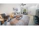 Bright living room features neutral paint, and a comfortable seating arrangement at 13084 Tigers Eye Dr, Venice, FL 34292