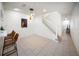 Spacious dining area featuring tiled floors, pendant lighting, and an open staircase at 13084 Tigers Eye Dr, Venice, FL 34292