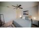 Comfortable bedroom featuring a ceiling fan, neutral decor, and a comfortable bed at 13084 Tigers Eye Dr, Venice, FL 34292