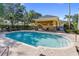 Inviting community pool area with a covered pavilion, lounge chairs, and a secure fence at 13084 Tigers Eye Dr, Venice, FL 34292